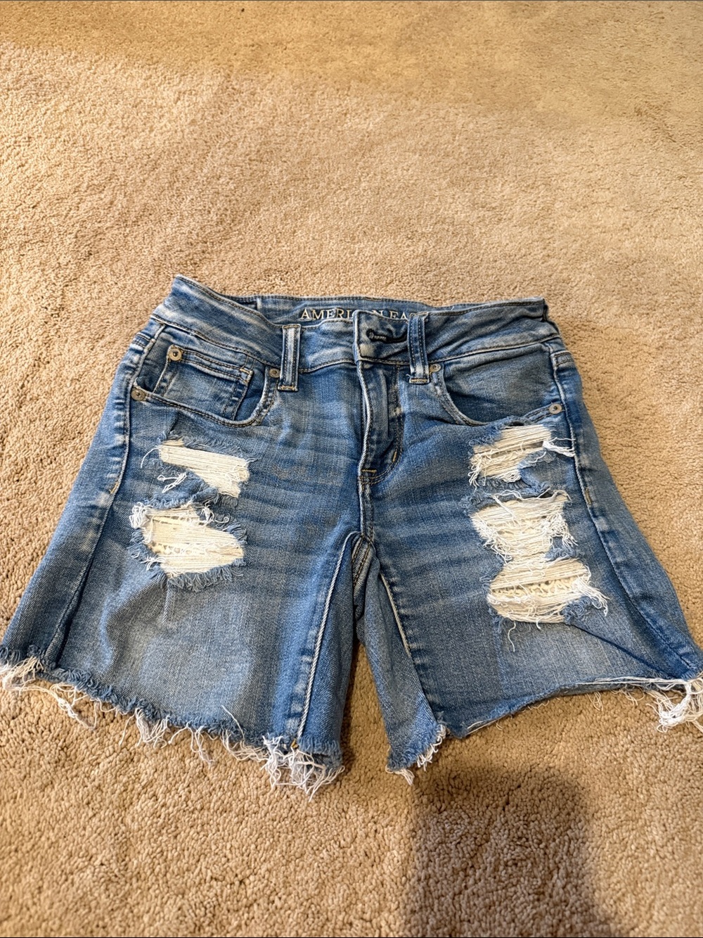 American Eagle Outfitters Ripped Light Blue Shorts with lace pockets underneath